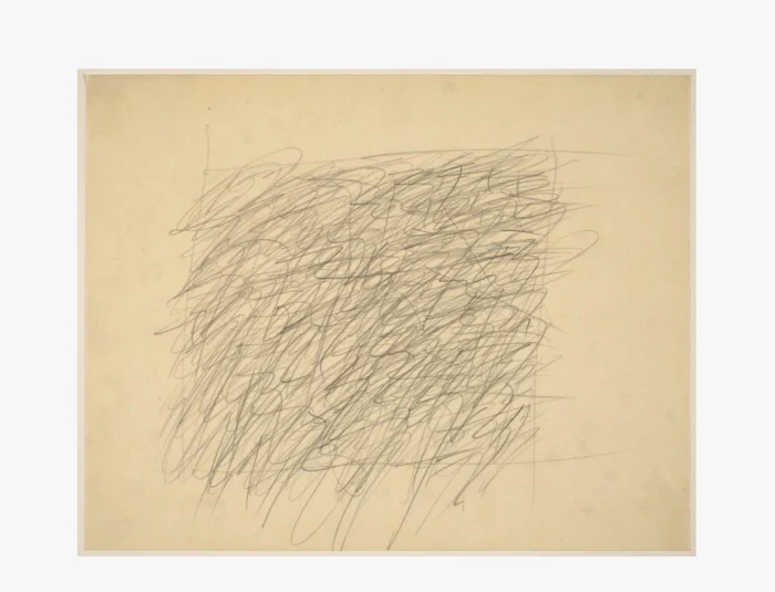 Abstract pencil scribbles filling a beige square on pale paper, like a freehand doodle.