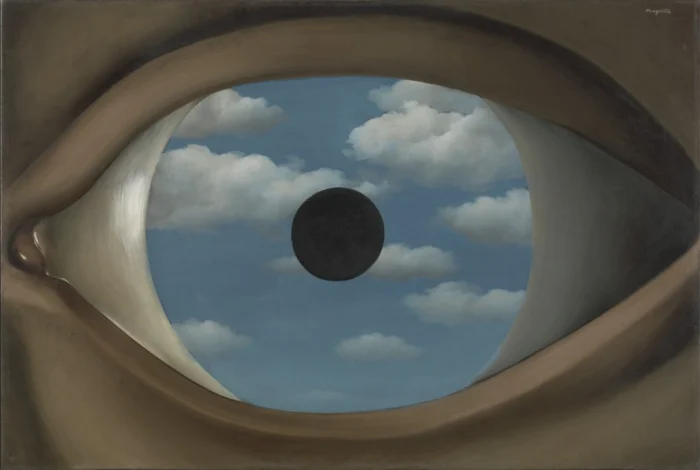 Rene Magritte The False Mirror Surreal eye close-up showing a blue sky with clouds in the iris and a black pupil in the center.